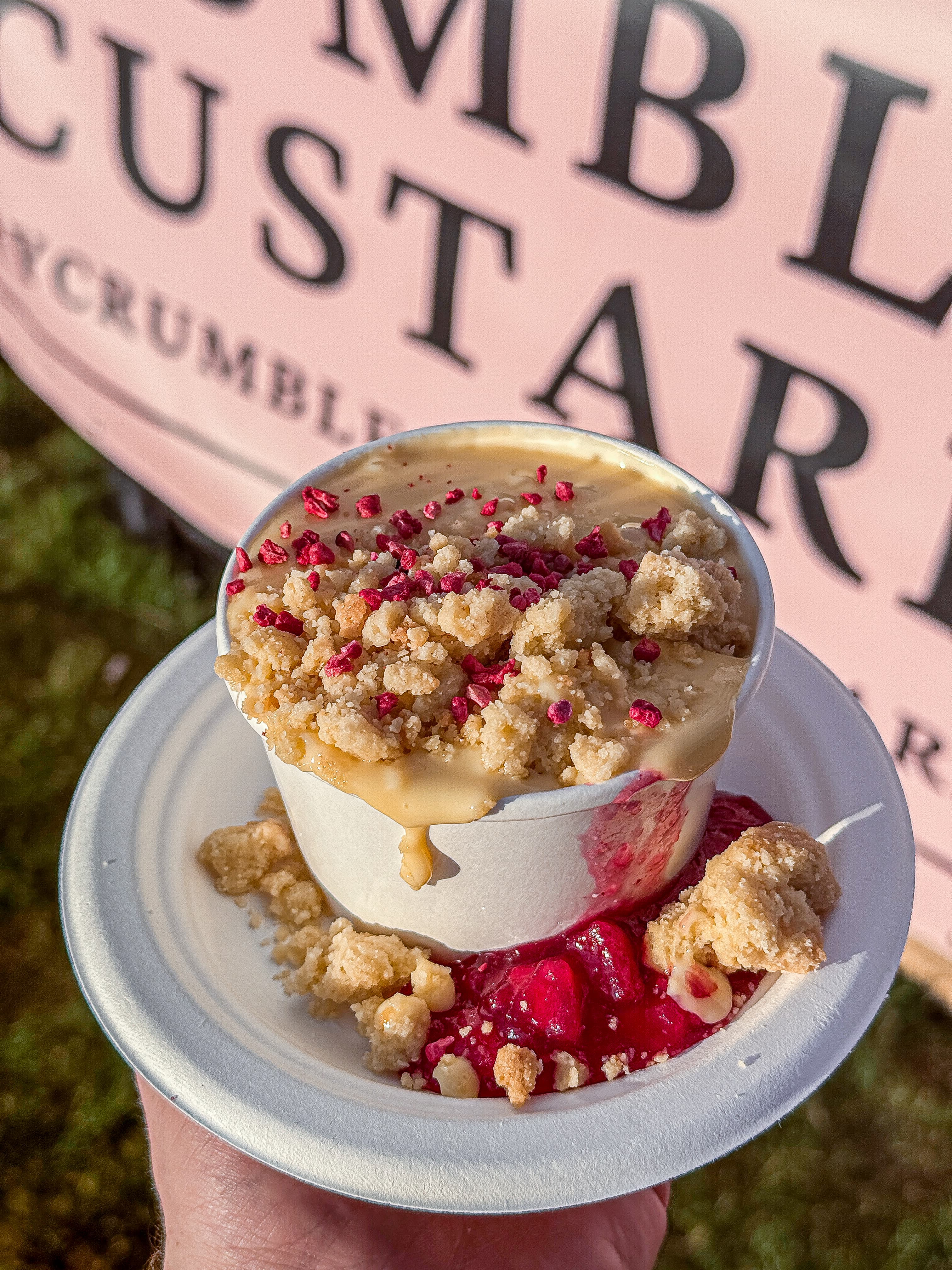 Apple & raspberry crumble served with custard